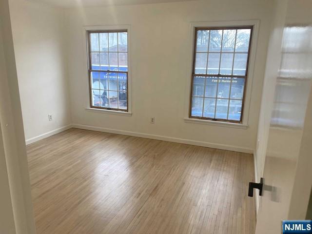 19-23 East Main Street, Unit B Ramsey, NJ 07446 - Photo 15 of 21 an empty room with windows