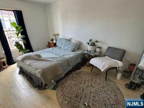 19-23 East Main Street, Unit B Ramsey, NJ 07446 - Photo 19 of 21 a bedroom with bed and a window