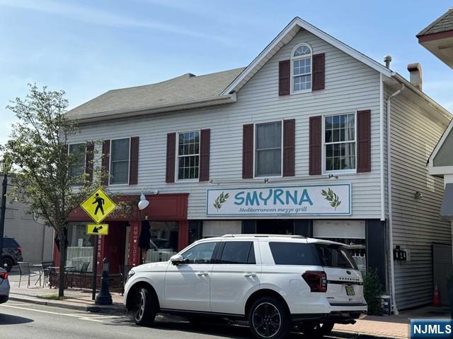 19-23 East Main Street, Unit B Ramsey, NJ 07446 - Photo 3 of 21 a view of a car park in front of house