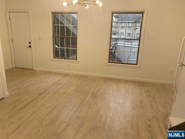 19-23 East Main Street, Unit B Ramsey, NJ 07446 - Photo 5 of 21 an empty room with windows