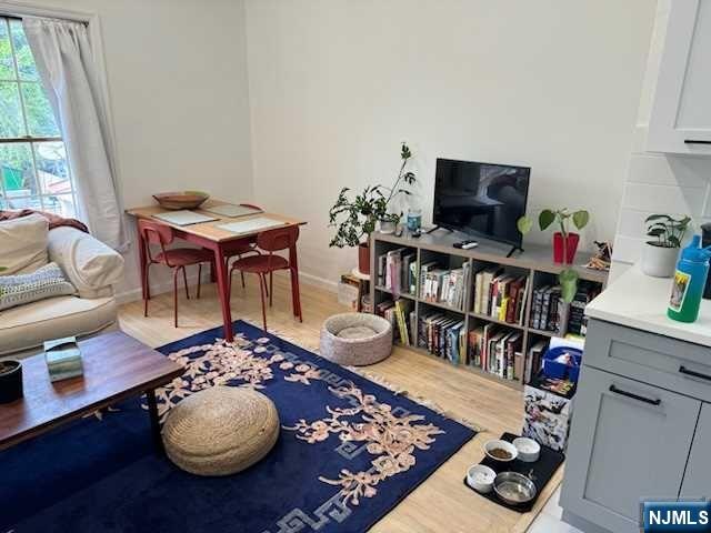 19-23 East Main Street, Unit B Ramsey, NJ 07446 - Photo 7 of 21 a living room with furniture and a flat screen tv