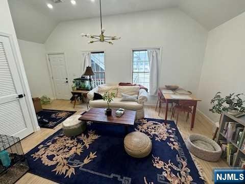 19-23 East Main Street, Unit B Ramsey, NJ 07446 - Photo 8 of 21 a living room with furniture and a chandelier