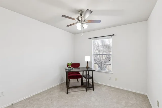 a workspace with furniture and window