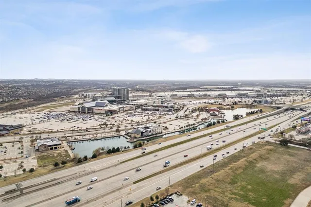an aerial view of a house with a large trees