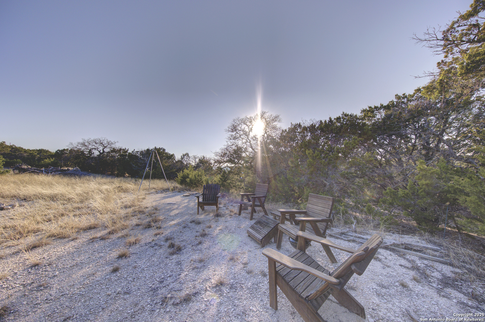 0 River Bend Road West Hunt, TX 78024 - Photo 17 of 55 a backyard of a house with table and chairs