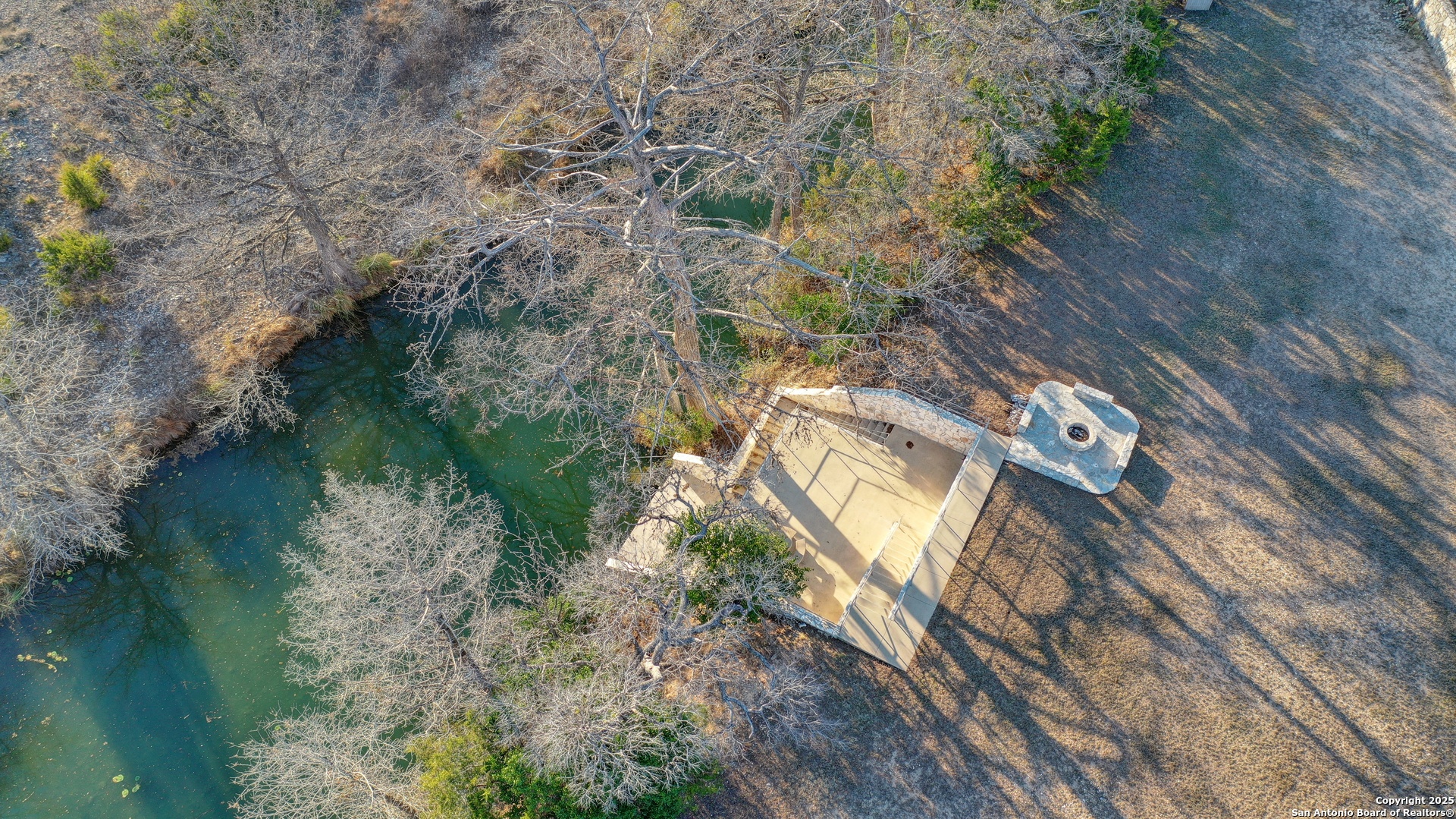 0 River Bend Road West Hunt, TX 78024 - Photo 51 of 55 a aerial view of a house with a yard and lake view