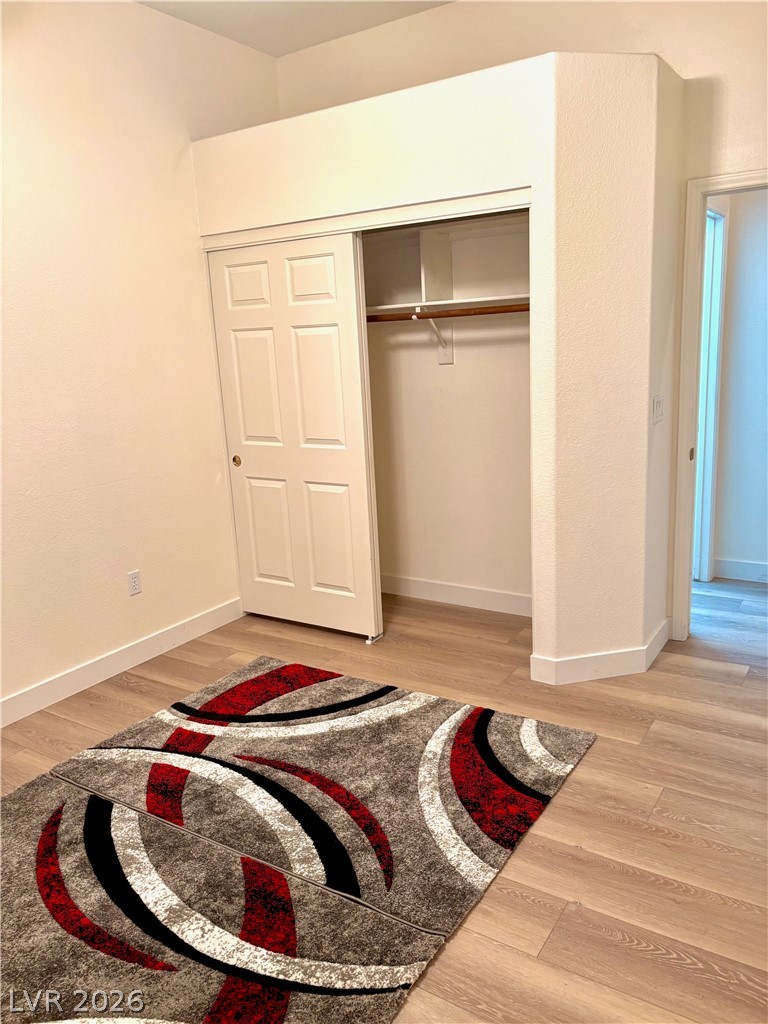 9040 Dove River Road Las Vegas, NV 89134 - Photo 16 of 22 Smooth wood-style flooring runs throughout this versatile room featuring a built-in closet.