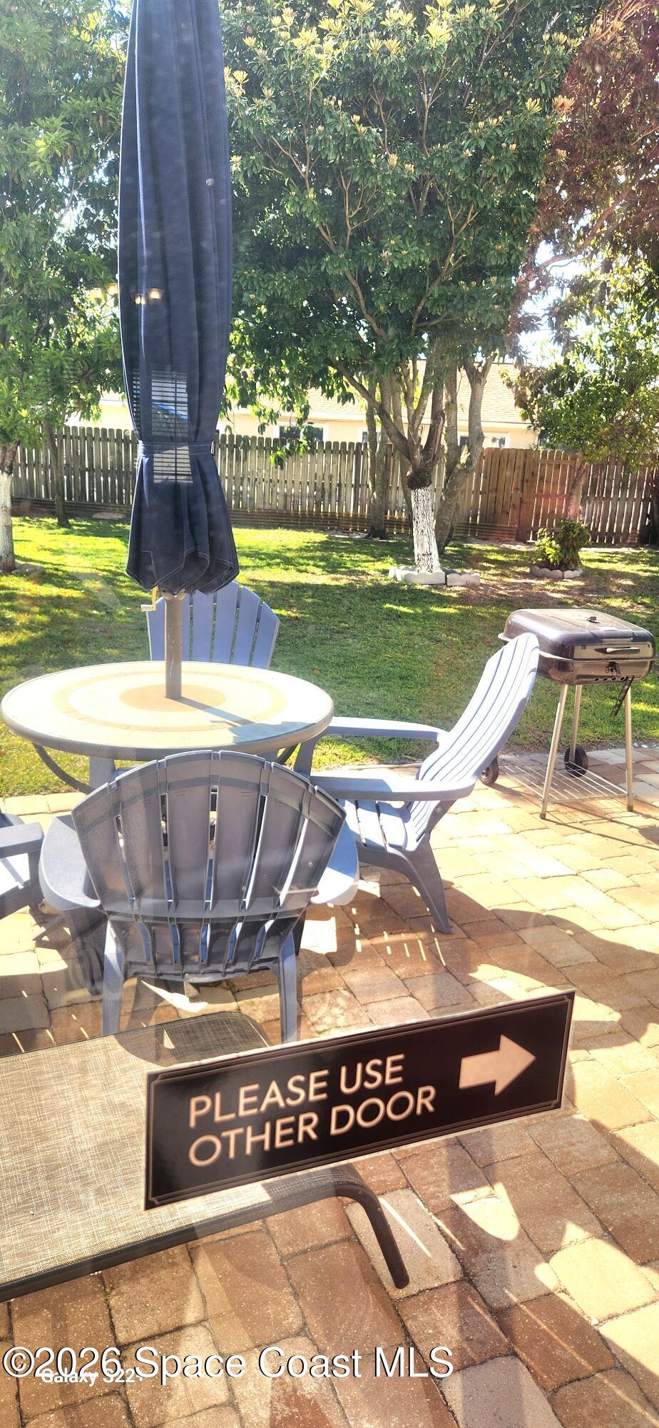 1327 Cherry Hills Road Northeast Palm Bay, FL 32905 - Photo 19 of 20 1327 cherry hills outside umbrella