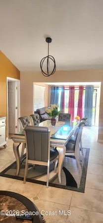 a living room with granite countertop furniture a rug and gym equipment