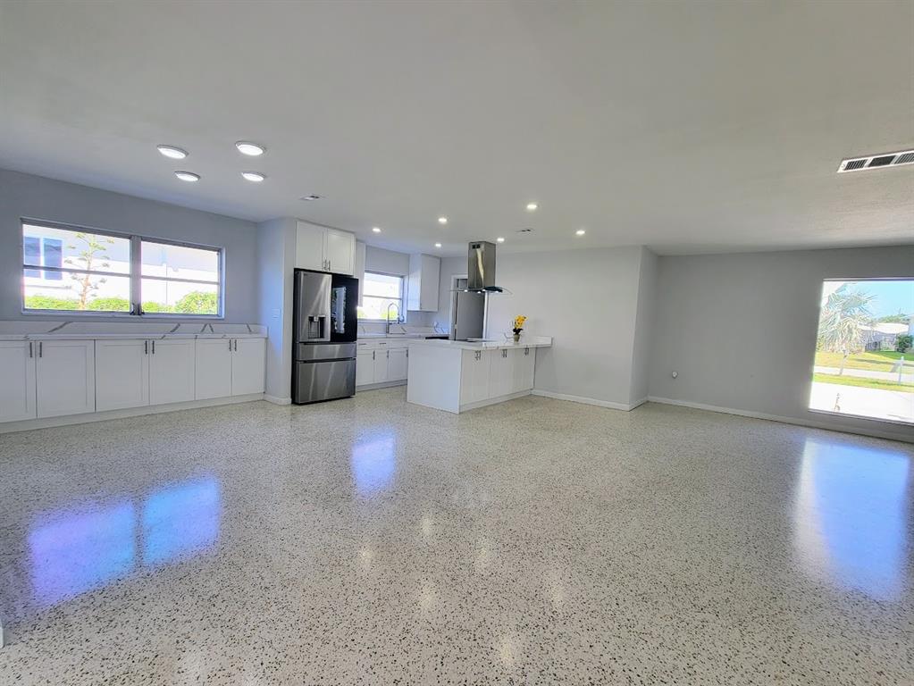 1732 Boca Raton Court Punta Gorda, FL 33950 - Photo 6 of 64 a view of a kitchen with a sink and a refrigerator