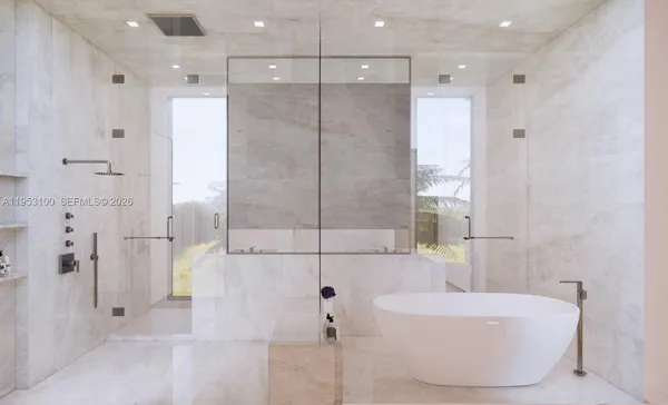 a bathroom with a tub shower and sink