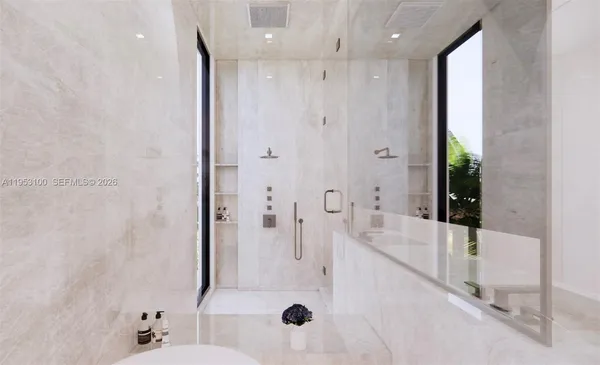 a bathroom with a double vanity sink toilet mirror and bathtub