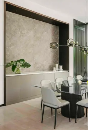 a view of a balcony with furniture and next to a window