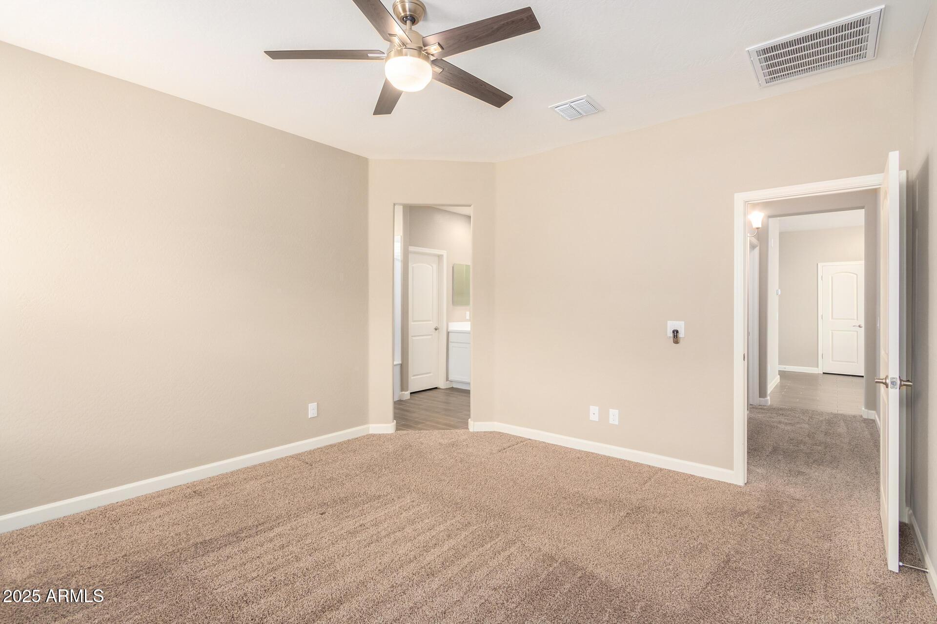 23882 West Ripple Road Buckeye, AZ 85326 - Photo 15 of 26 a view of an empty room and window