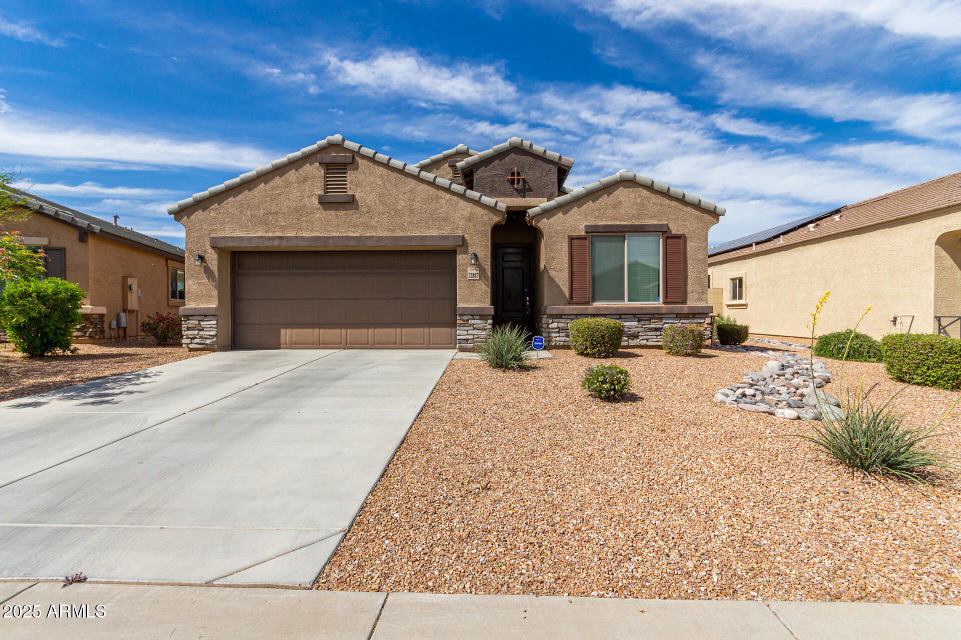 23882 West Ripple Road Buckeye, AZ 85326 - Photo 2 of 30 a view of a white house with a outdoor space