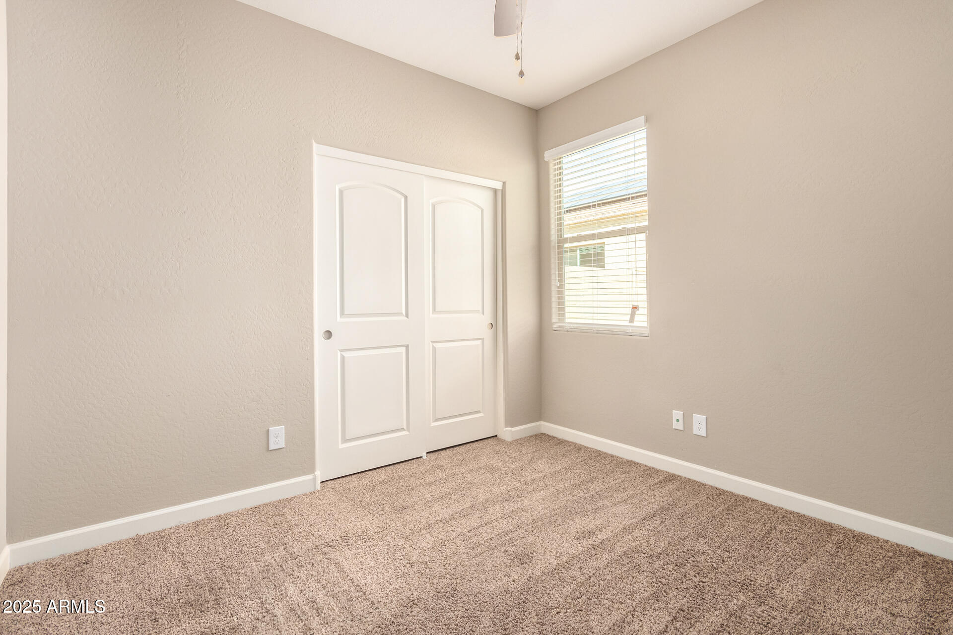 23882 West Ripple Road Buckeye, AZ 85326 - Photo 22 of 30 an empty room with windows