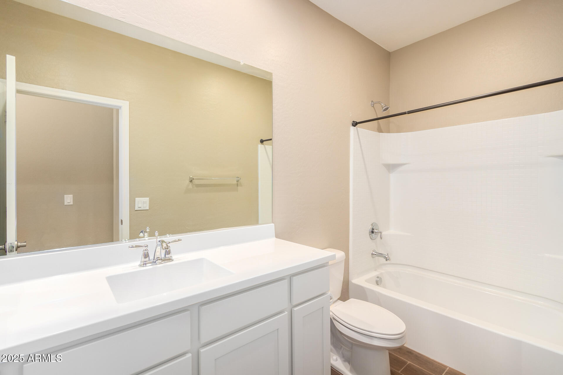 23882 West Ripple Road Buckeye, AZ 85326 - Photo 24 of 30 a bathroom with a sink a toilet and shower