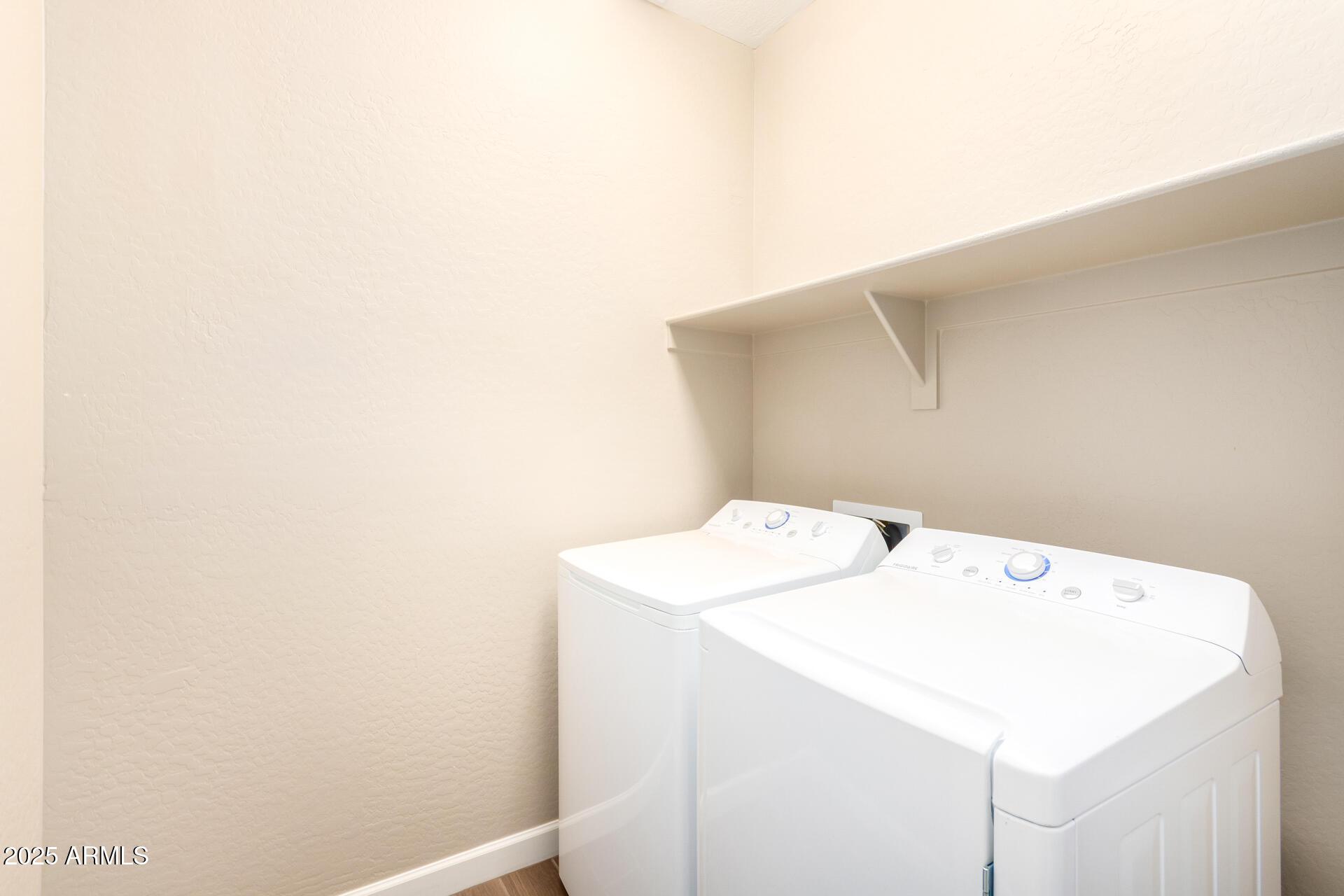 23882 West Ripple Road Buckeye, AZ 85326 - Photo 25 of 26 a utility room with dryer and washer