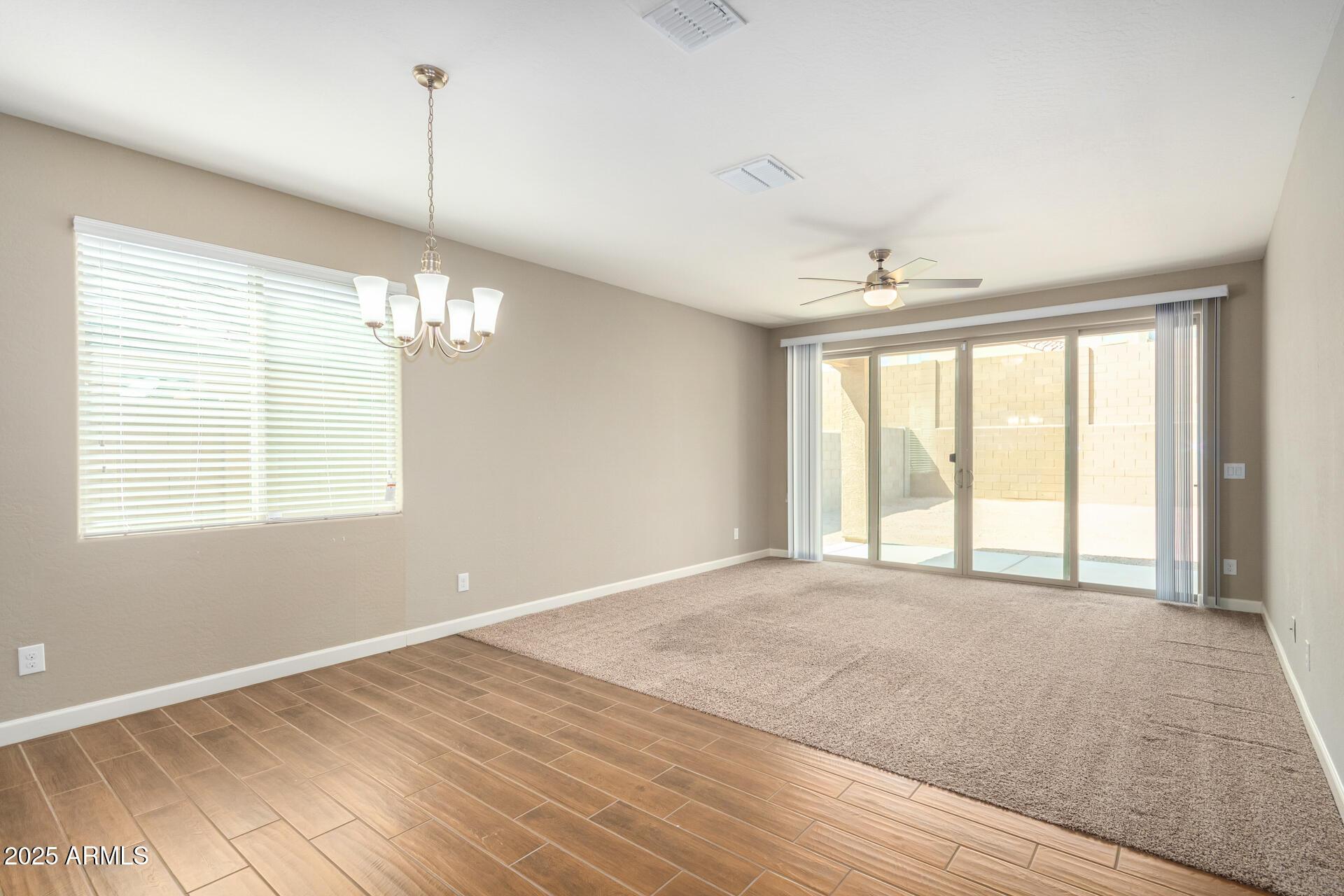 23882 West Ripple Road Buckeye, AZ 85326 - Photo 7 of 26 a view of an empty room with a window