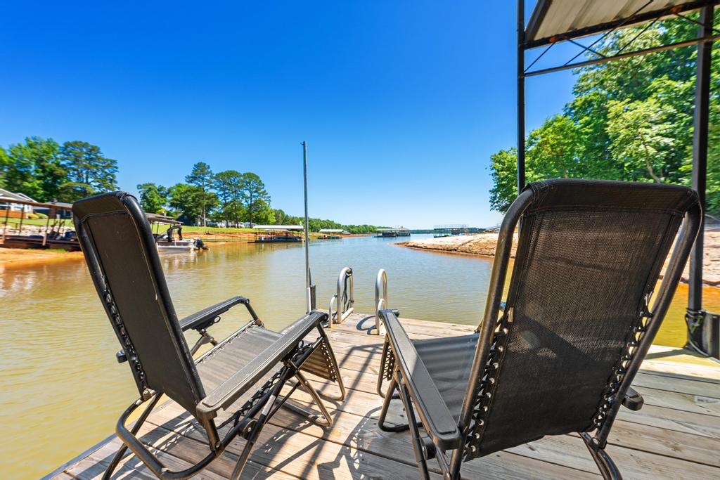 217 Maret Road Townville, SC 29689 - Photo 32 of 35 A tranquil waterfront setting with a private dock invites serene relaxation.