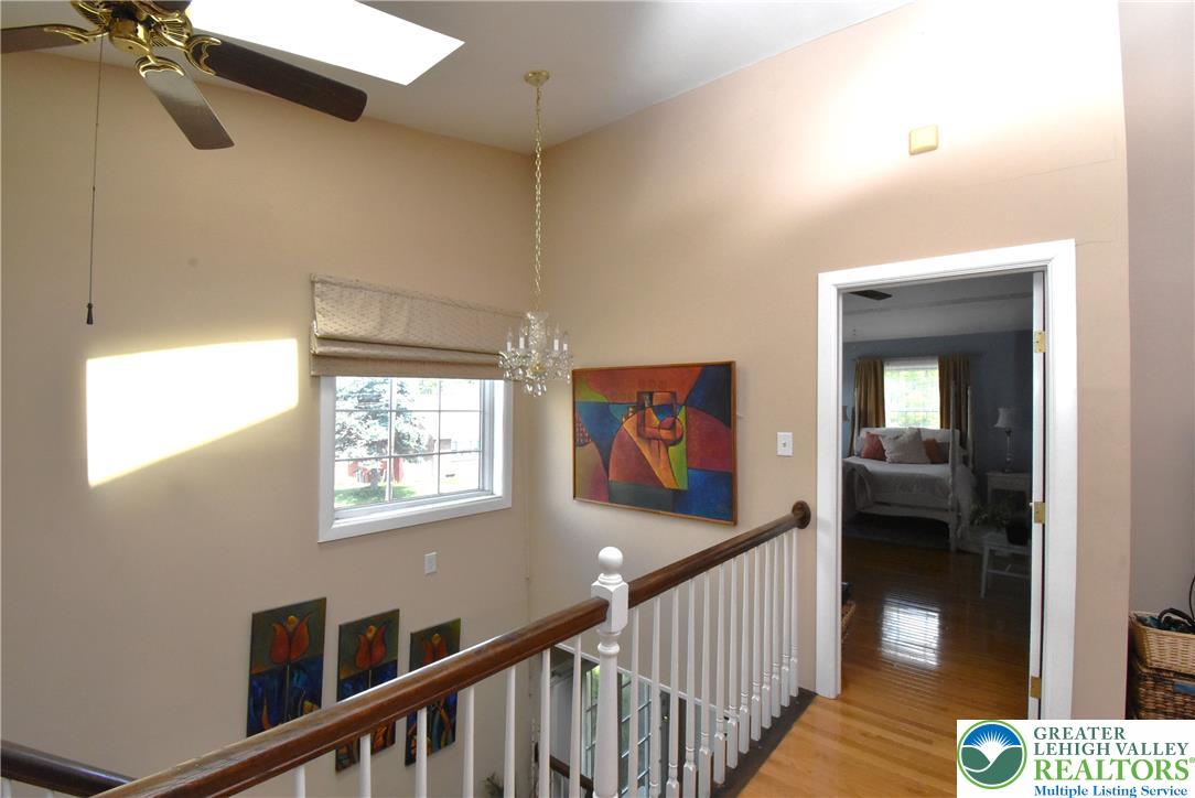 424 Grape Street Whitehall, PA 18052 - Photo 38 of 56 This brightly lit hallway showcases architectural details and warm wood flooring.