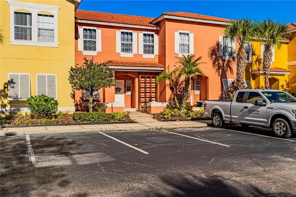 a view of a car park in front of a house