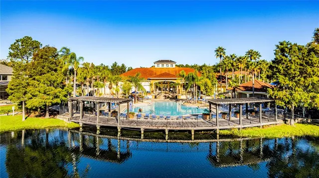a view of a swimming pool with outdoor seating