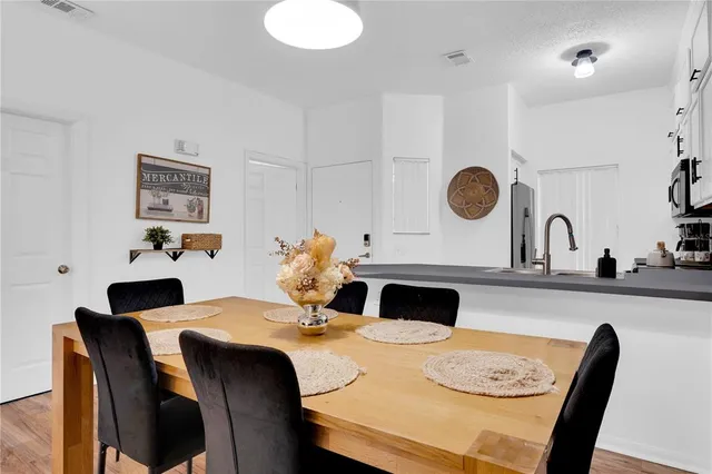 a dining room with furniture and window