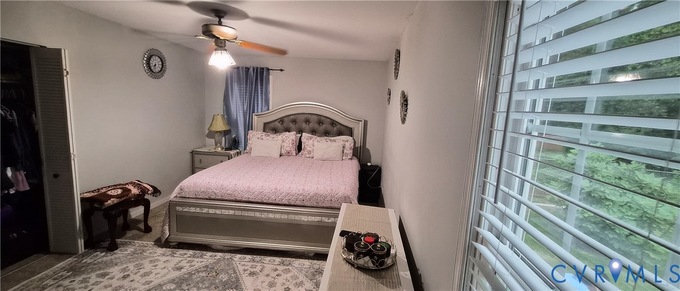 12409 Locustgrove Road Henrico, VA 23238 - Photo 13 of 40 Bedroom featuring a ceiling fan with light fixture