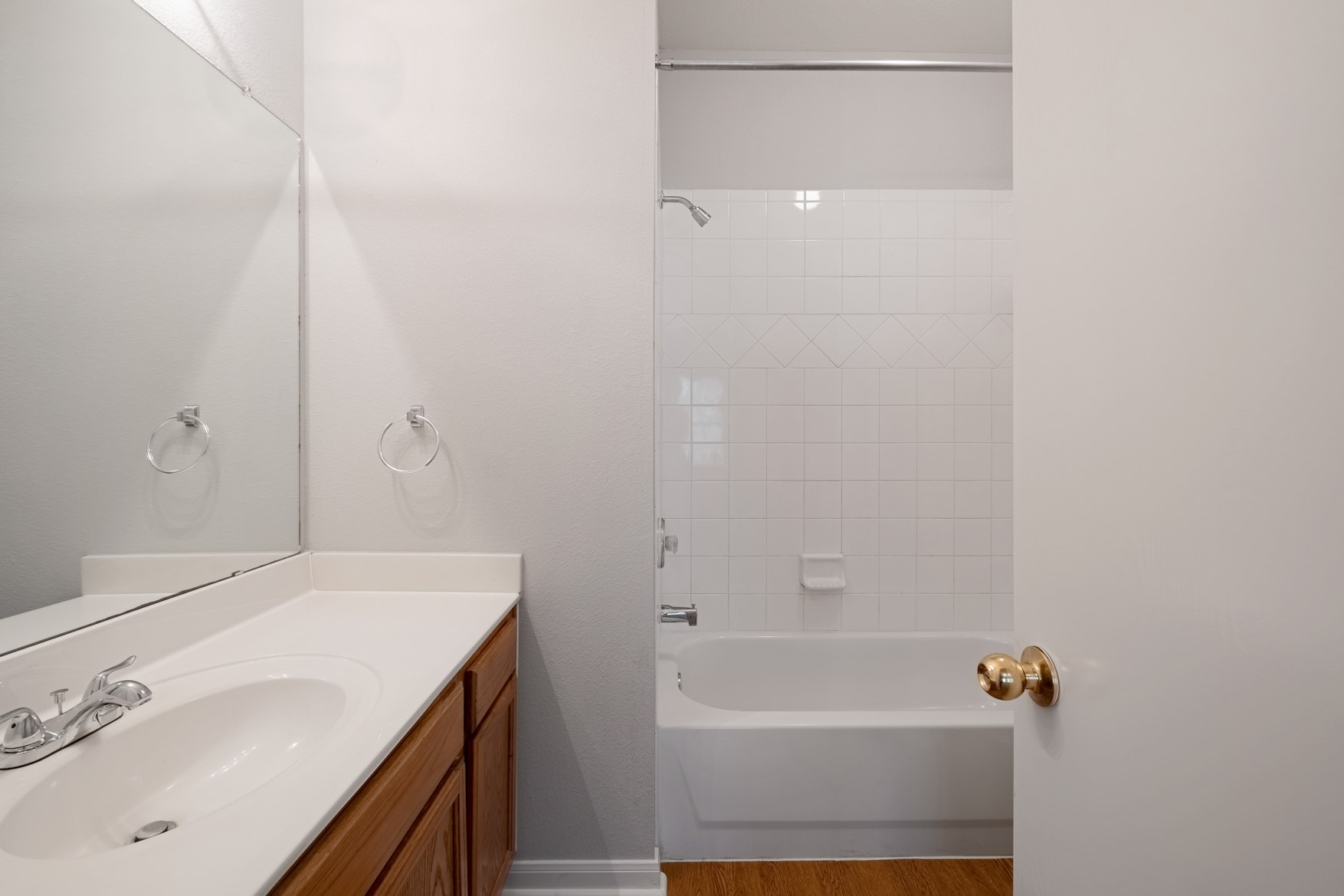 2300 South Bagdad Road, Unit B Leander, TX 78641 - Photo 15 of 20 a bathroom with a bathtub a sink and a mirror