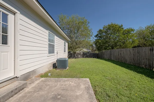 a backyard of a house with lots of green space