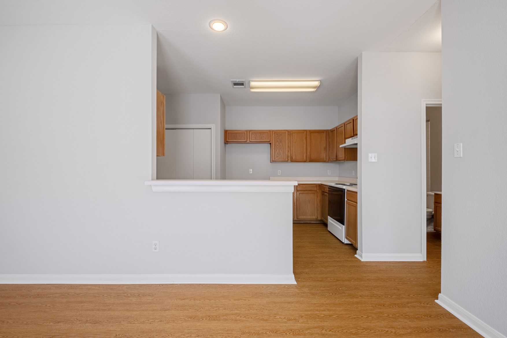 2300 South Bagdad Road, Unit B Leander, TX 78641 - Photo 4 of 20 a view of cabinets and wooden floor