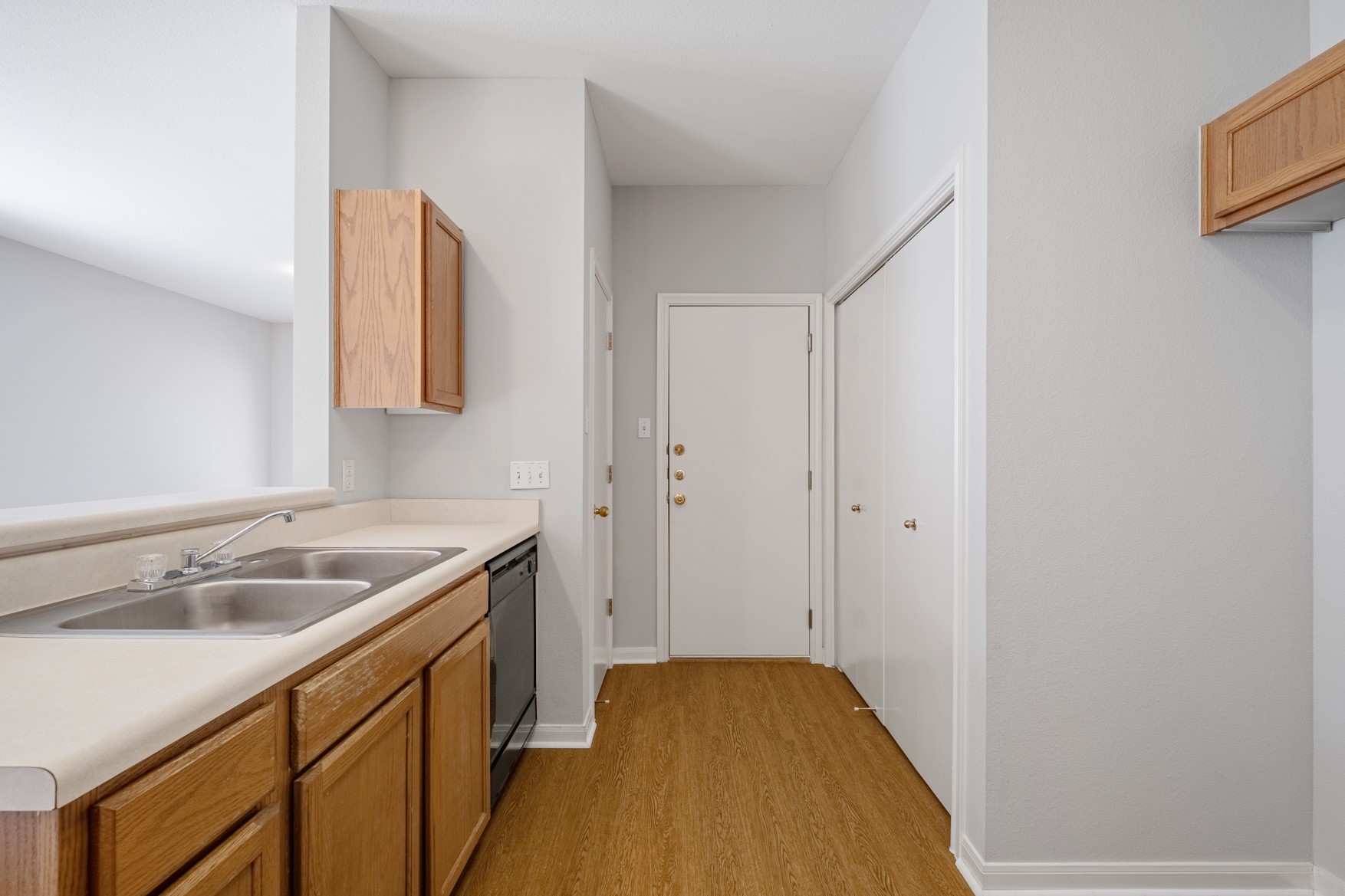 2300 South Bagdad Road, Unit B Leander, TX 78641 - Photo 5 of 20 a kitchen with a sink and a wooden floor