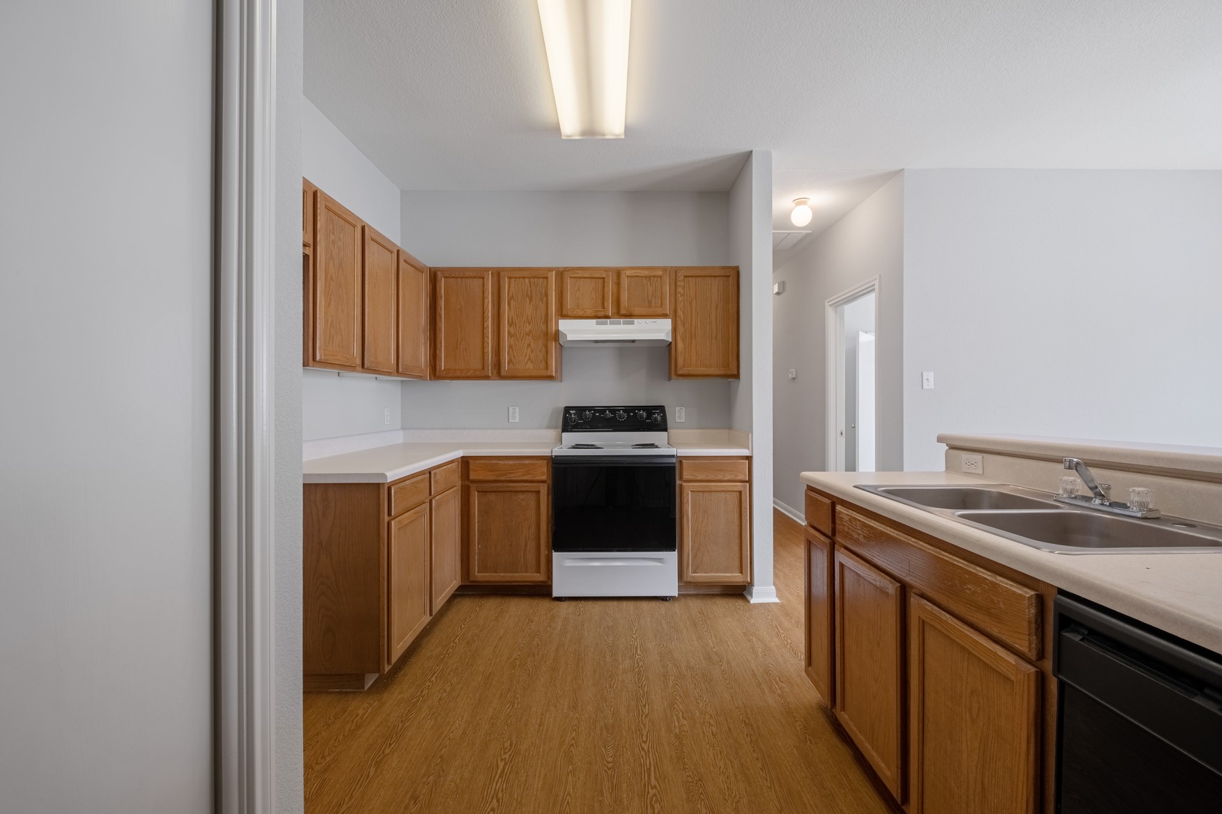 2300 South Bagdad Road, Unit B Leander, TX 78641 - Photo 6 of 20 a kitchen with a sink and a stove top oven