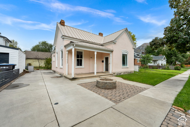 119 400 South Provo, UT 84606 - Photo 2 of 17 Single-story residence with a metal roof and a covered front porch with columns