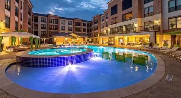 a view of a swimming pool with a patio