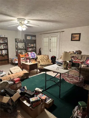 a living room with furniture and a chandelier