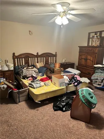 a bed room with furniture and a lamp