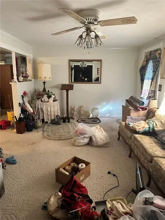 a bedroom with furniture and a chandelier