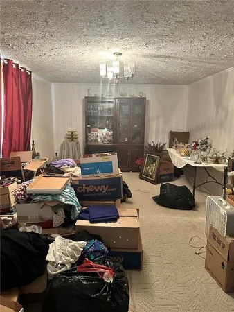 a bedroom with furniture and a chandelier