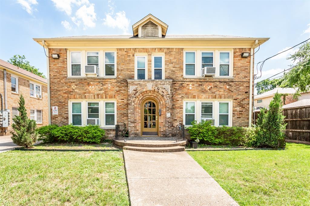 5900 Oram Street, Unit 7 Dallas, TX 75206 - Photo 1 of 1 front view of a brick house with a yard
