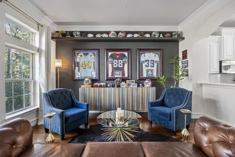 a living room with furniture and a window