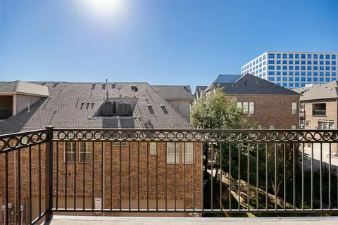 a view of a balcony with wooden floor