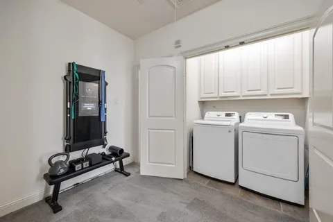 a car parked in front of a white house