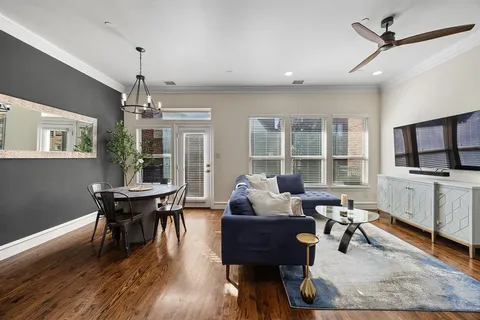 a living room with fireplace furniture and a flat screen tv