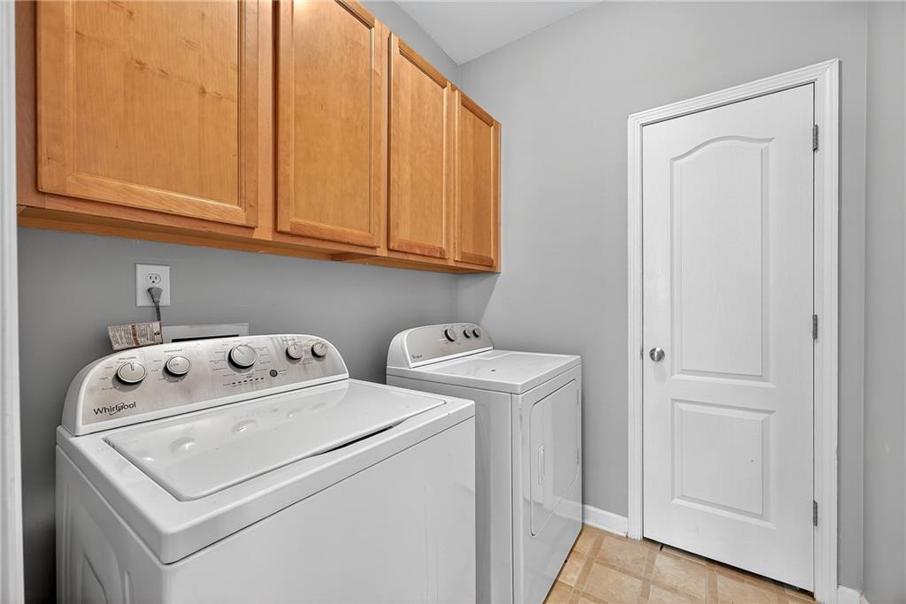 4249 Rosehall Court Atlanta, GA 30349 - Photo 13 of 28 a utility room with dryer and washer