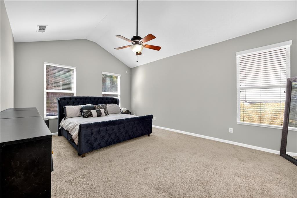 4249 Rosehall Court Atlanta, GA 30349 - Photo 14 of 28 a living room with furniture chandelier and a window