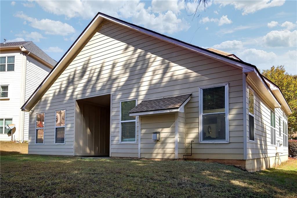 4249 Rosehall Court Atlanta, GA 30349 - Photo 27 of 28 a view of house with backyard