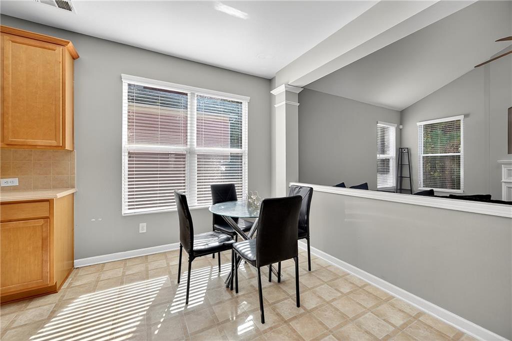 4249 Rosehall Court Atlanta, GA 30349 - Photo 8 of 28 a view of a dining room with furniture and windows