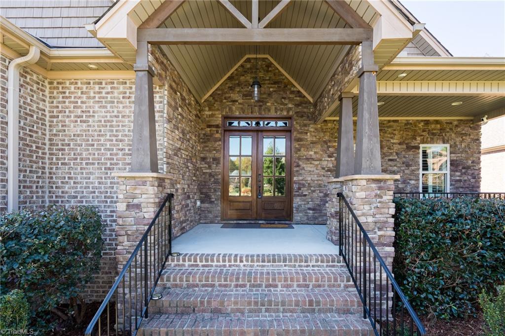 8900 West Pepper Court Oak Ridge, NC 27310 - Photo 4 of 50 Front Porch into the Entrance